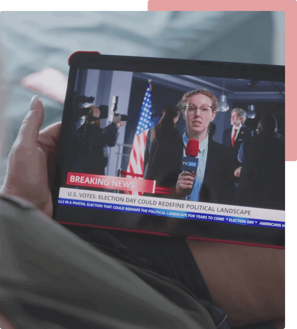 A person holding an ipad with a news story on it.