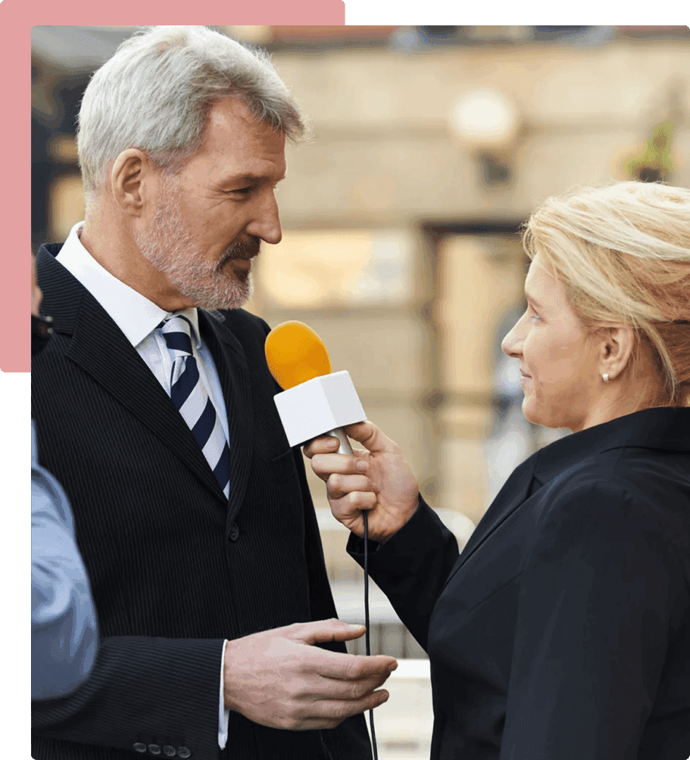 A man and woman are holding microphones in their hands.
