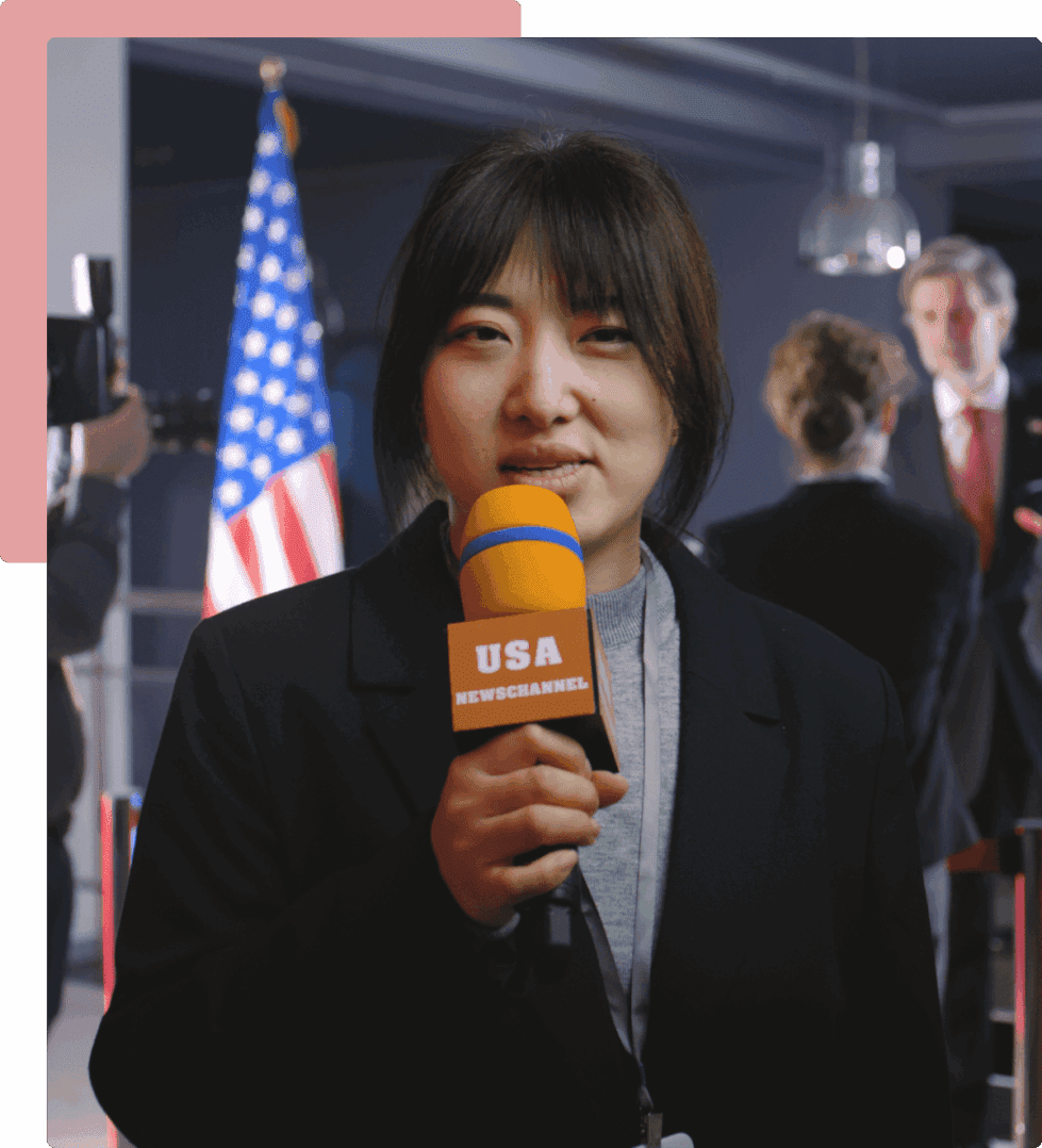 A woman holding an orange microphone in front of the american flag.